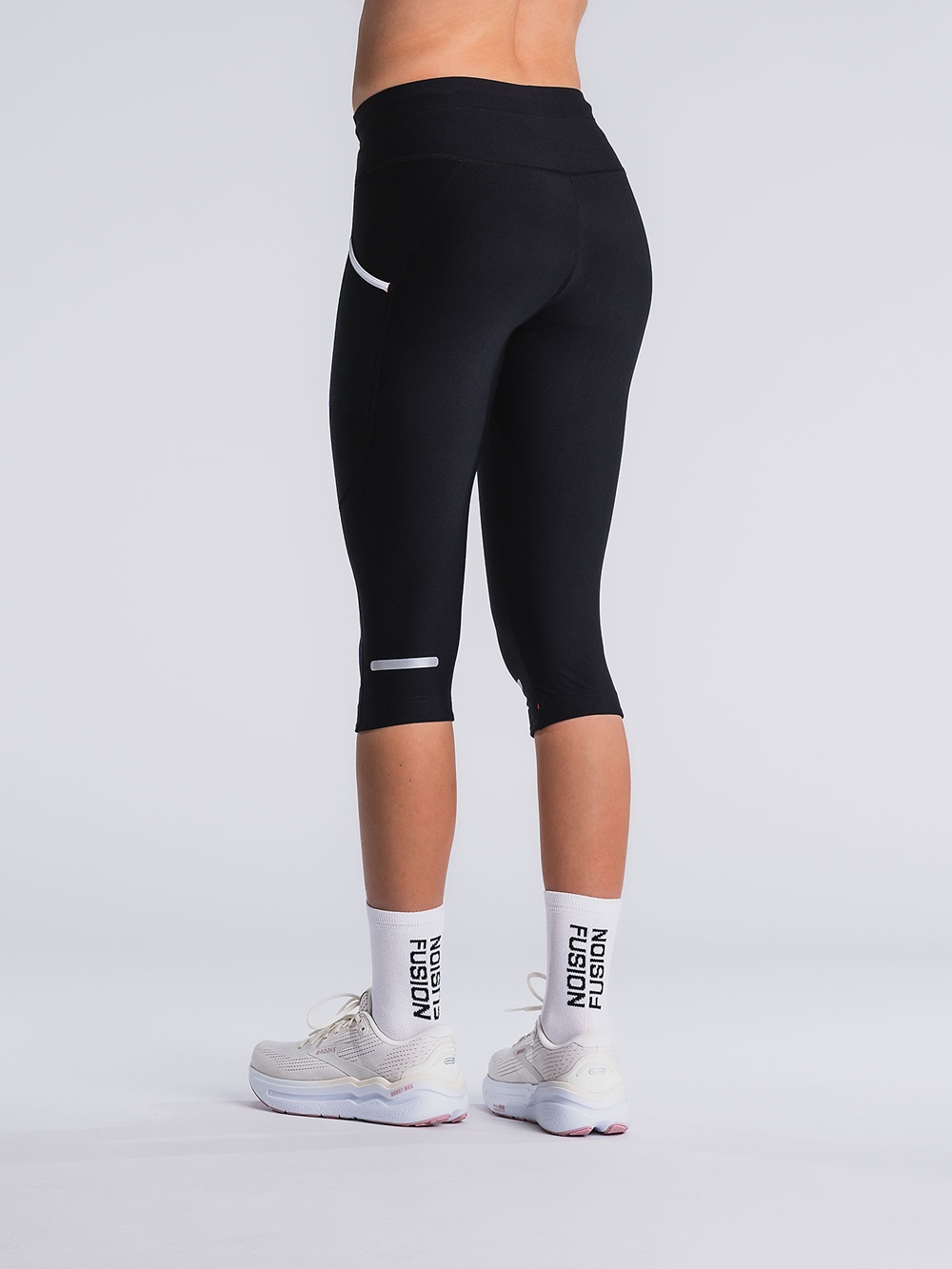 Unisex 3/4 Tights in Schwarz mit seitlicher Oberschenkeltasche und reflektierenden Elementen