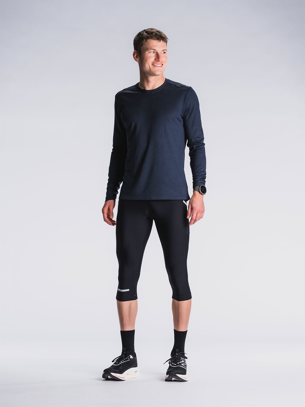Unisex 3/4 Tights in Schwarz mit seitlicher Oberschenkeltasche und reflektierenden Elementen