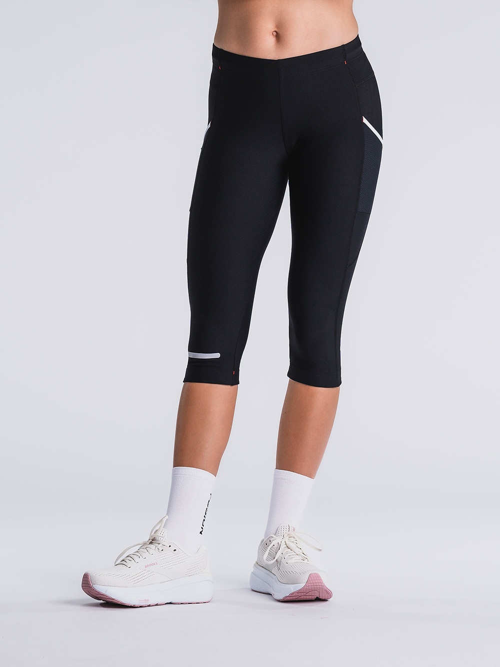 Unisex 3/4 Tights in Schwarz mit seitlicher Oberschenkeltasche und reflektierenden Elementen